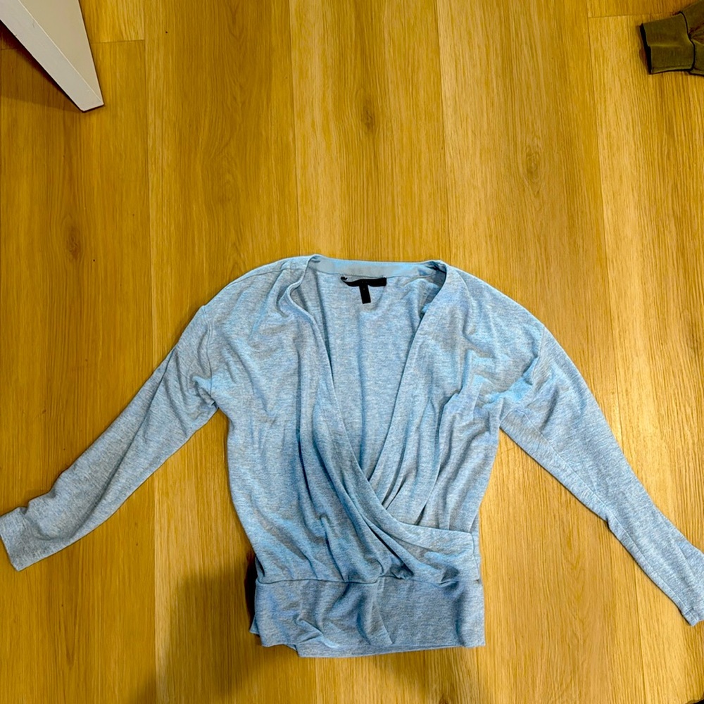 Light heather blue crossover top in size small.